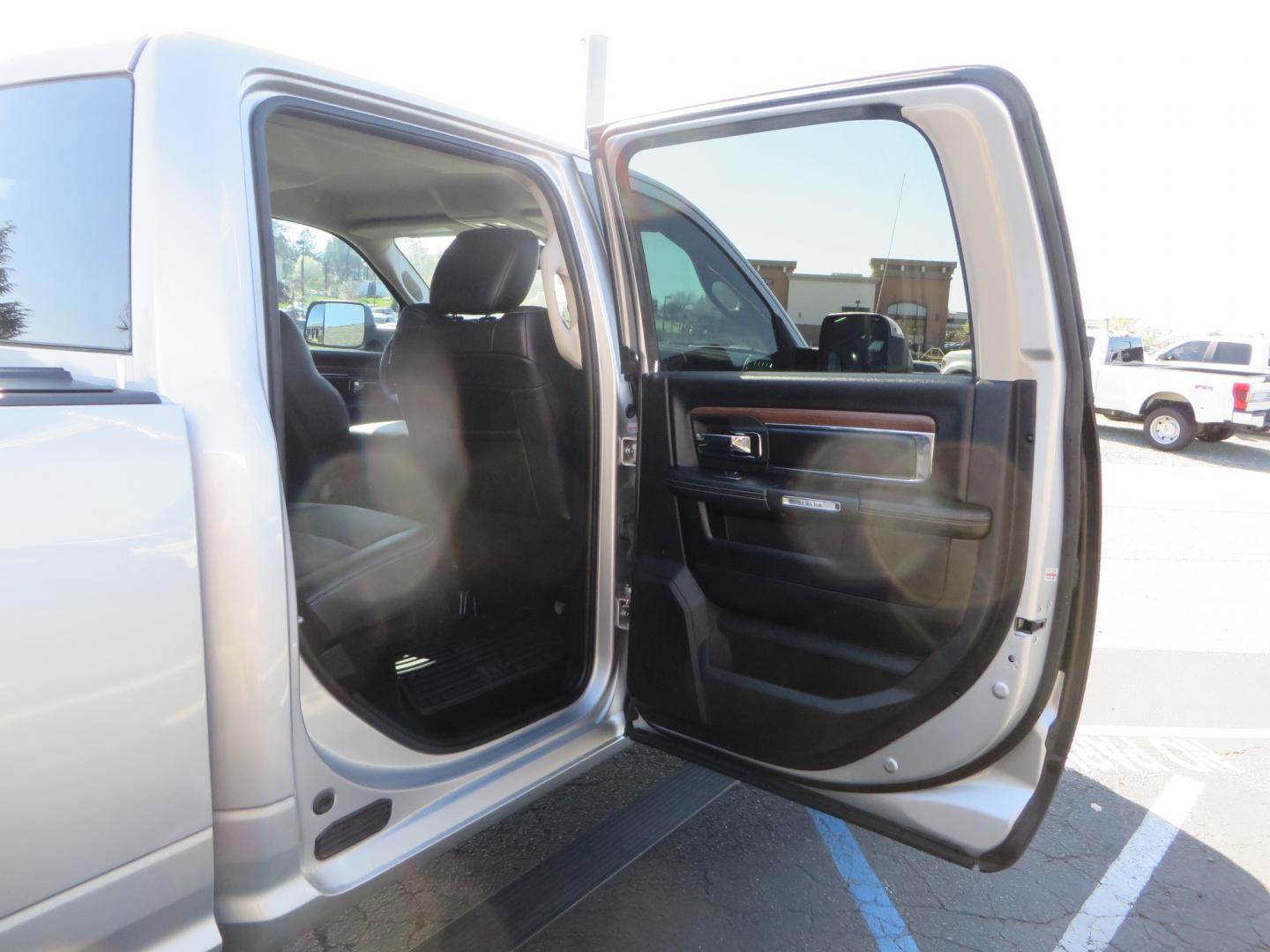 2016 SILVER /BLACK RAM 2500 Laramie Crew Cab SWB 4WD (3C6UR5FL3GG) with an 6.7L L6 OHV 24V TURBO DIESEL engine, 6A transmission, located at 2630 Grass Valley Highway, Auburn, CA, 95603, (530) 508-5100, 38.937893, -121.095482 - Leveled Ram sitting on Fuel Offroad wheels, Falken Wildpeak AT tires, Amp Power steps, Rolling Bed cover, Color matched fender flares, and window tint. - Photo#49